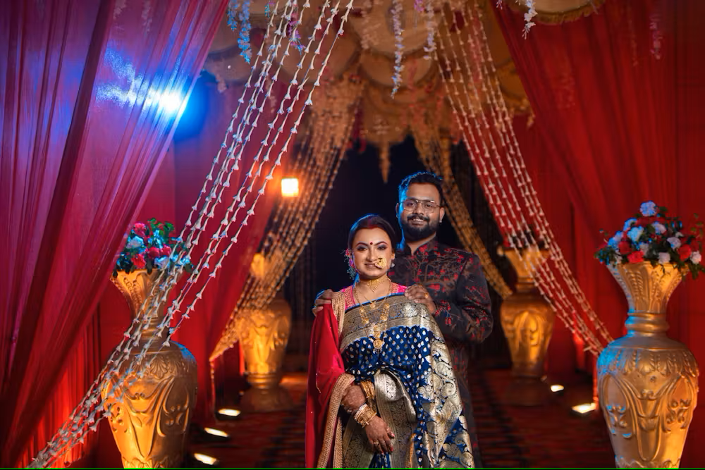Indian wedding setup with a beautifully decorated stage and seating arrangement in a hotel