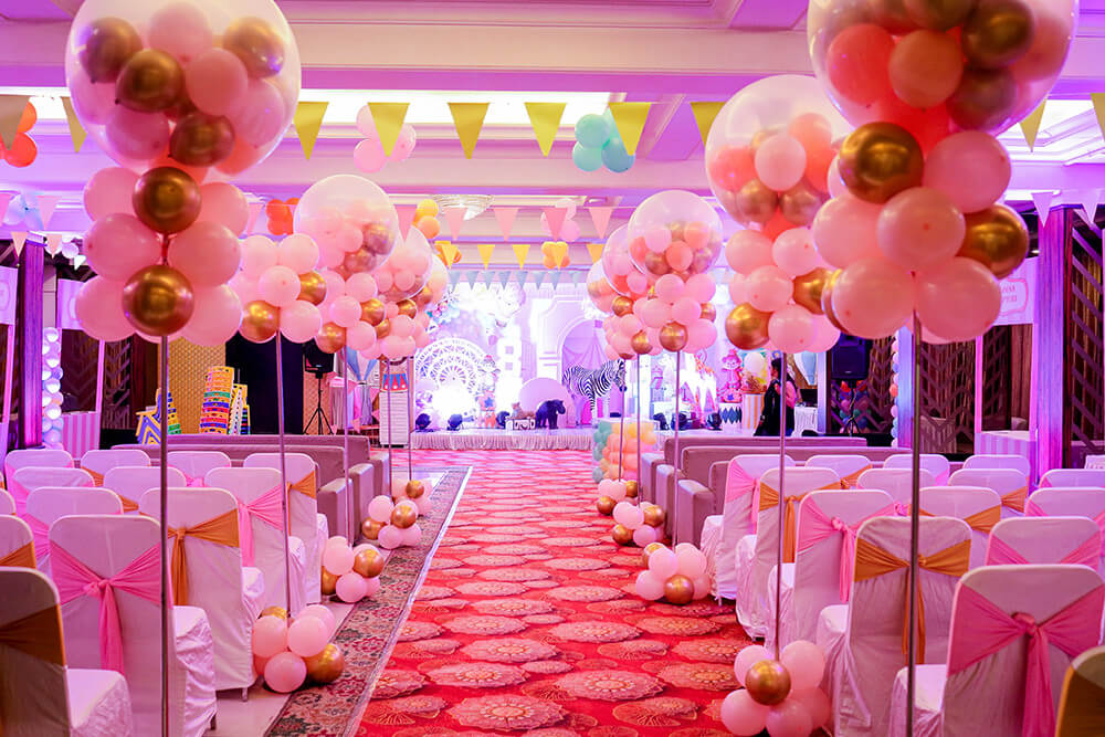 Indian wedding setup with a beautifully decorated stage and seating arrangement in a hotel
