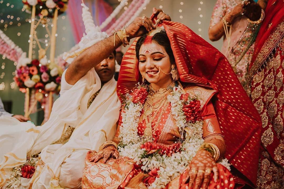 Indian wedding setup with a beautifully decorated stage and seating arrangement in a hotel