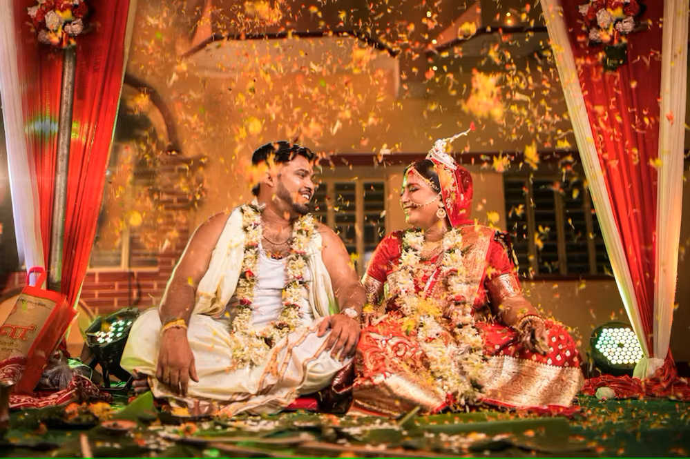 Indian bride and groom in traditional attire at a hotel wedding