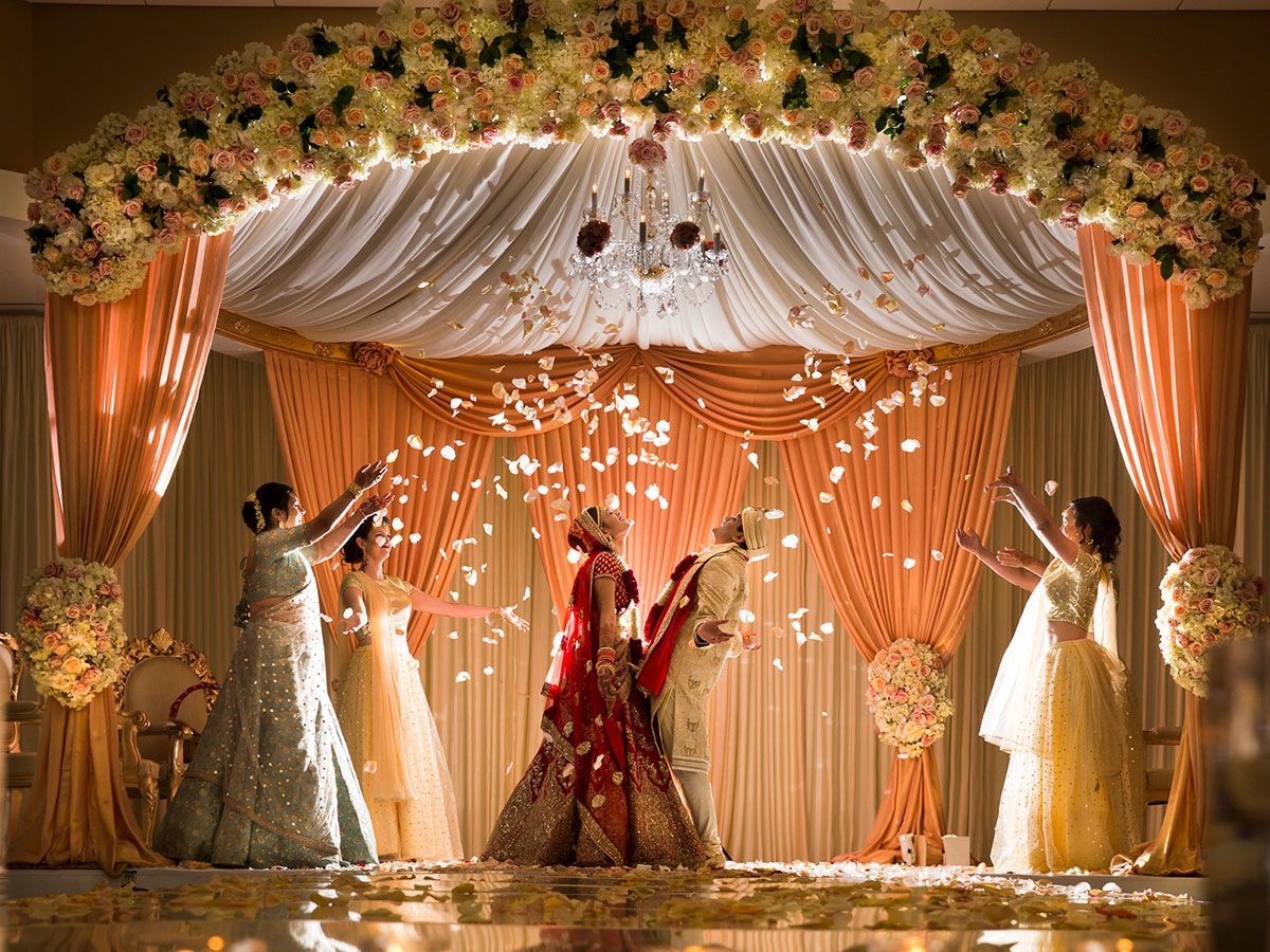 Indian wedding banquet setup with tables and decorations in a hotel