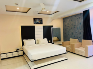 Superior Twin Bedroom-romm-new with two beds, modern decor, and a city view through large windows